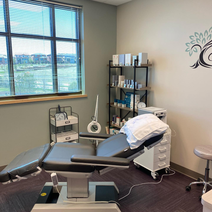 Patient treatment room, bright with natural lighting, clean, and comfortable. At Artistry Skin & Laser.